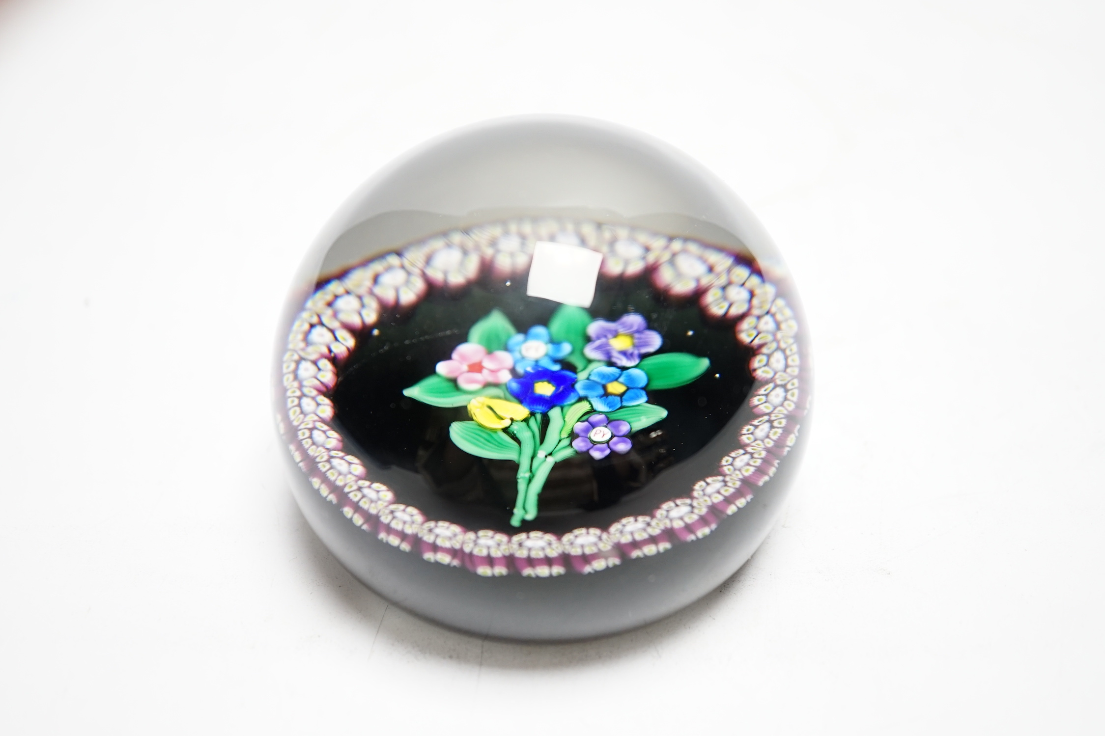 A rare Paul Ysart ‘small flower bouquet’ paperweight with double ‘PY’ cane, Caithness period, CG paper label to base, 7.5cm